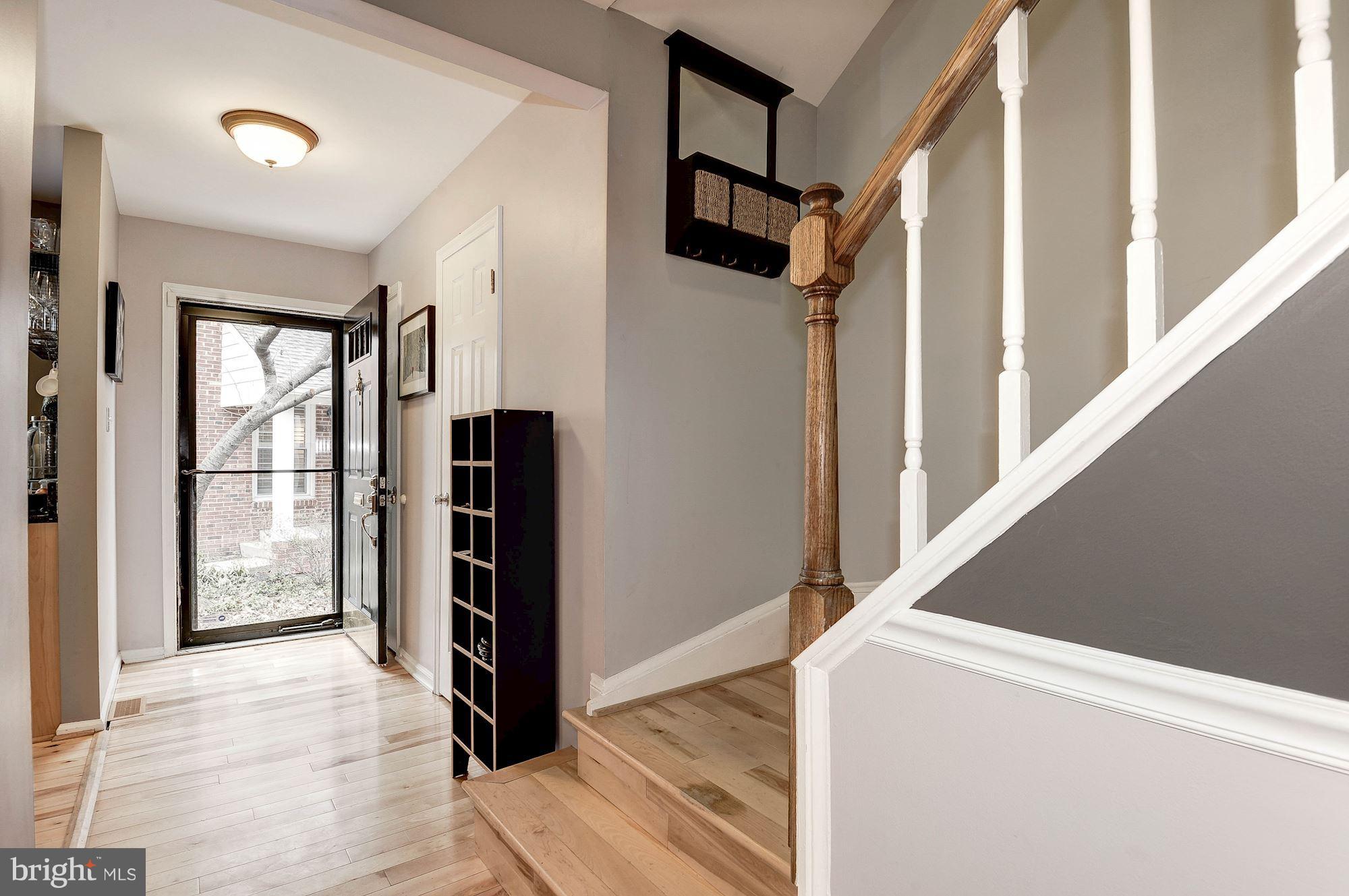 2546 South Walter Reed Drive, Unit 3 Arlington, VA 22206 - Photo 15 of 30 a view of hallway with stairs and wooden floor