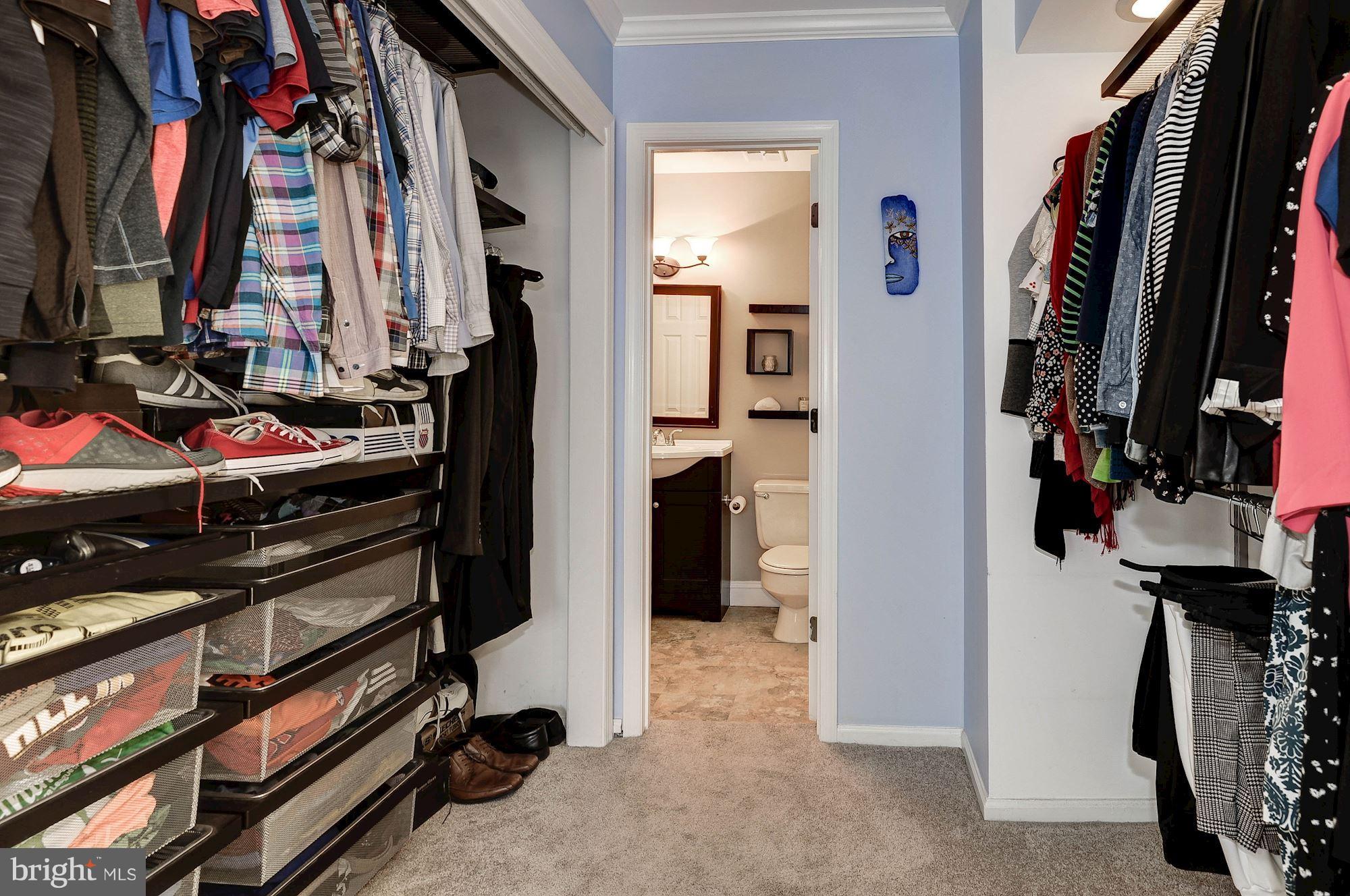 2546 South Walter Reed Drive, Unit 3 Arlington, VA 22206 - Photo 18 of 30 a view of walk in closet with clothes and shoes