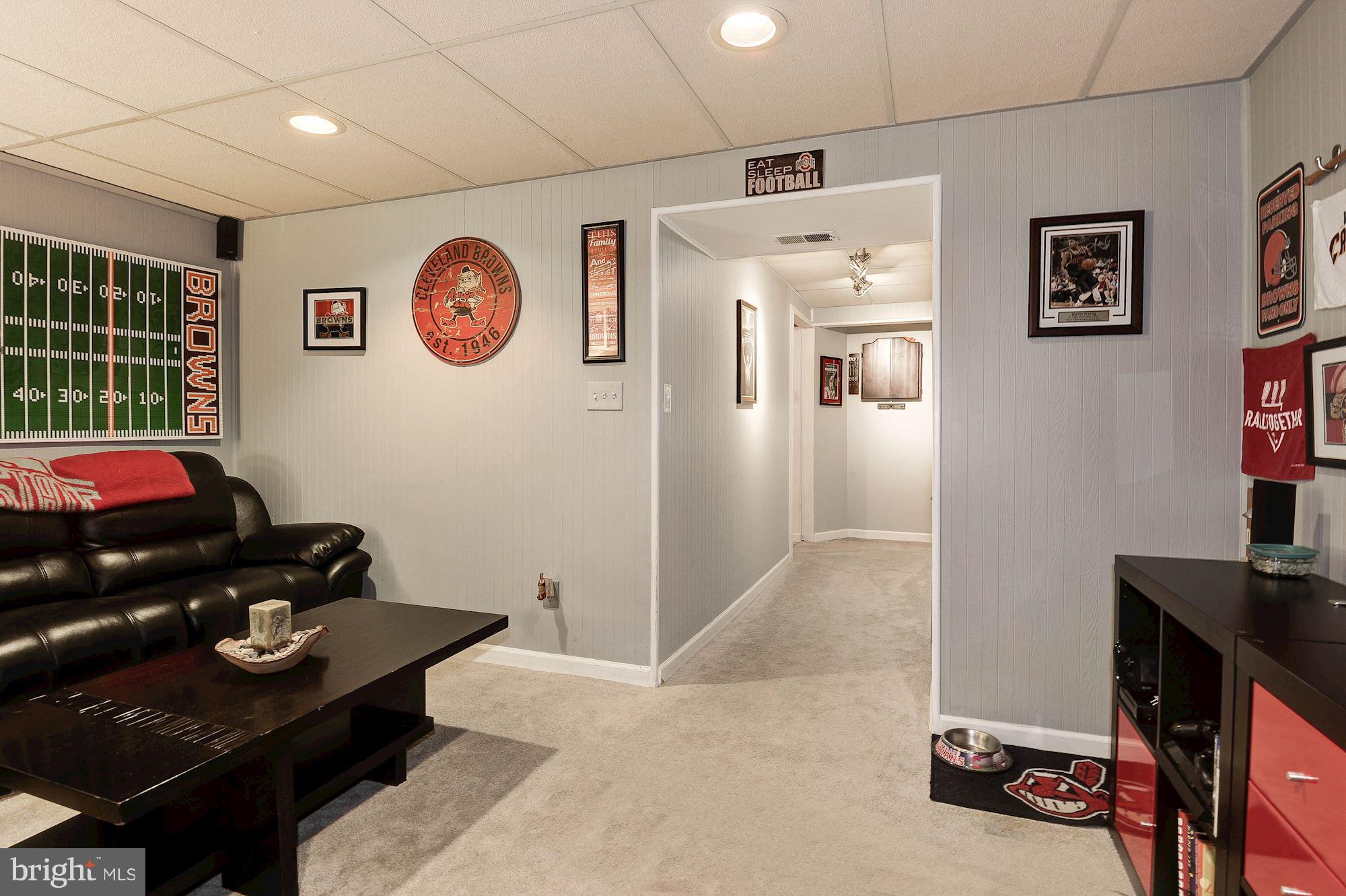 2546 South Walter Reed Drive, Unit 3 Arlington, VA 22206 - Photo 23 of 30 a living room with furniture and a flat screen tv