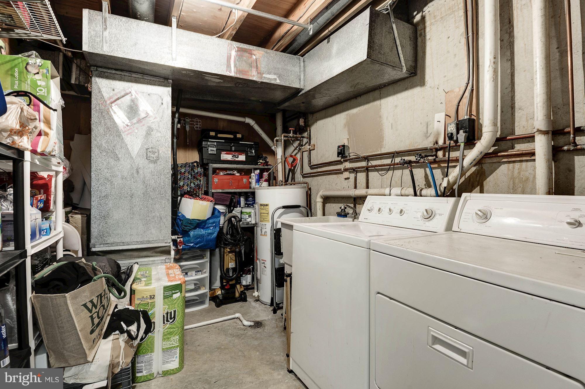 2546 South Walter Reed Drive, Unit 3 Arlington, VA 22206 - Photo 26 of 30 a utility room with dryer and washer