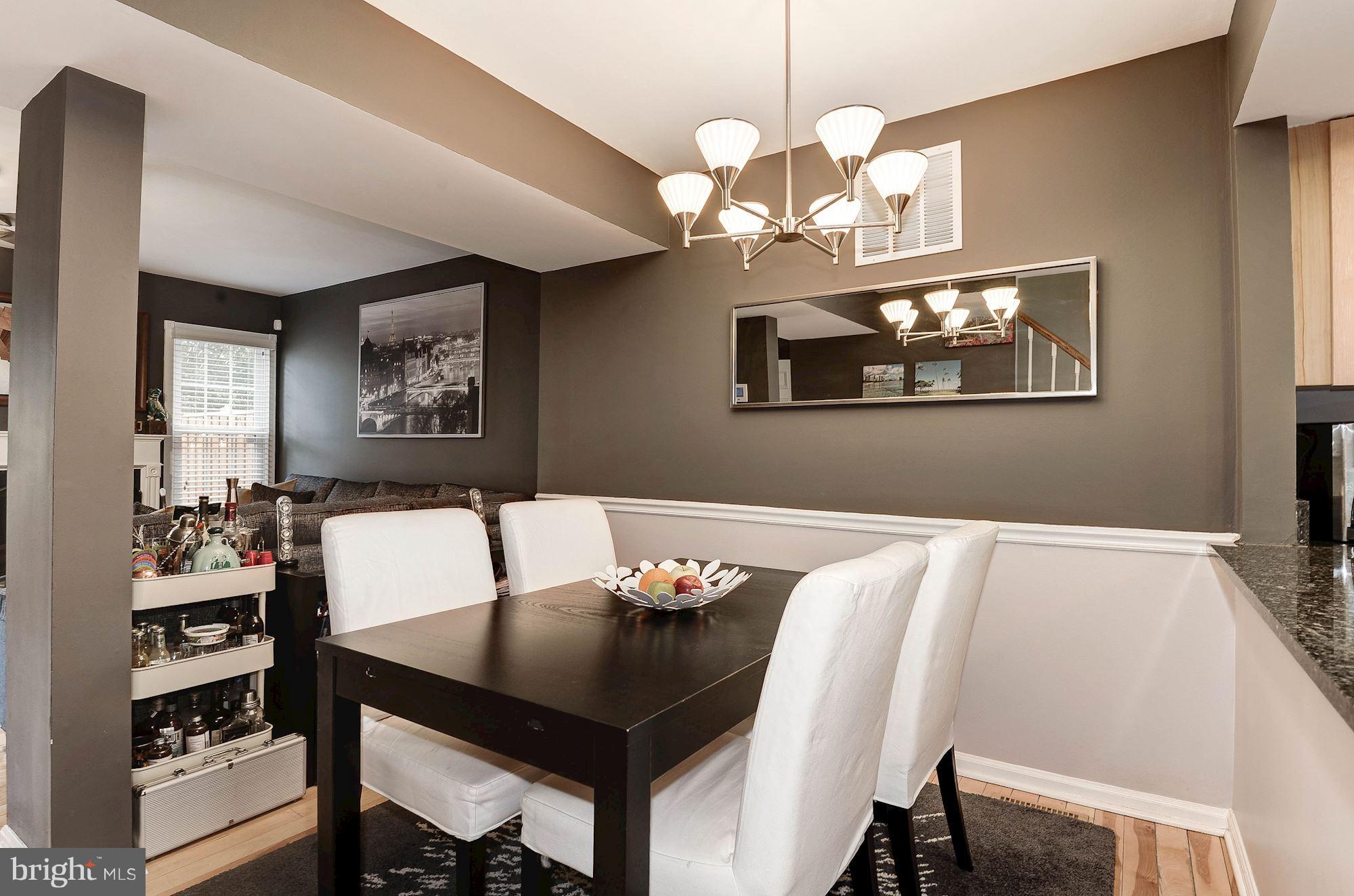 2546 South Walter Reed Drive, Unit 3 Arlington, VA 22206 - Photo 8 of 30 a view of a dining room with furniture and chandelier