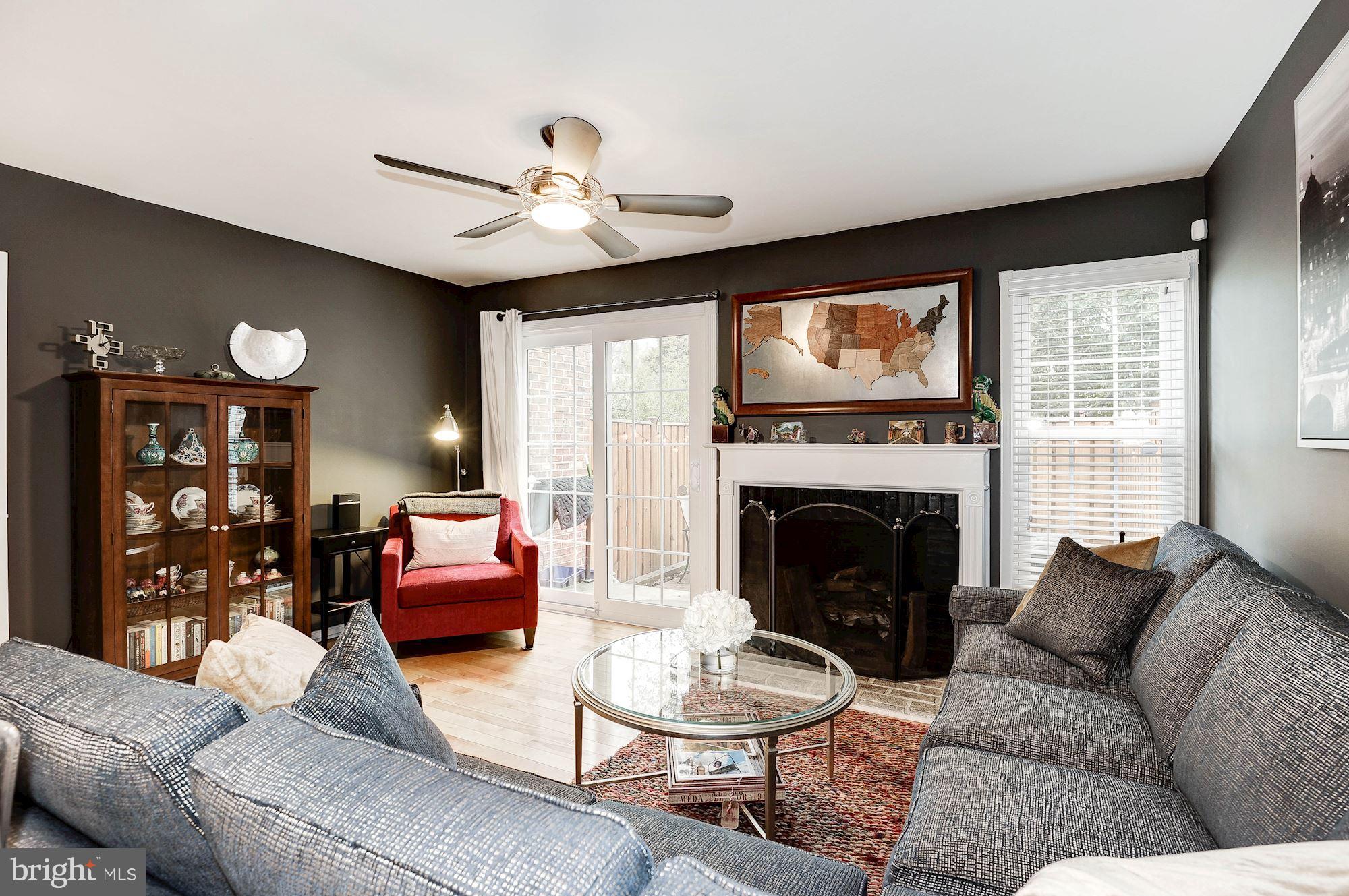2546 South Walter Reed Drive, Unit 3 Arlington, VA 22206 - Photo 10 of 30 a living room with furniture and a fireplace