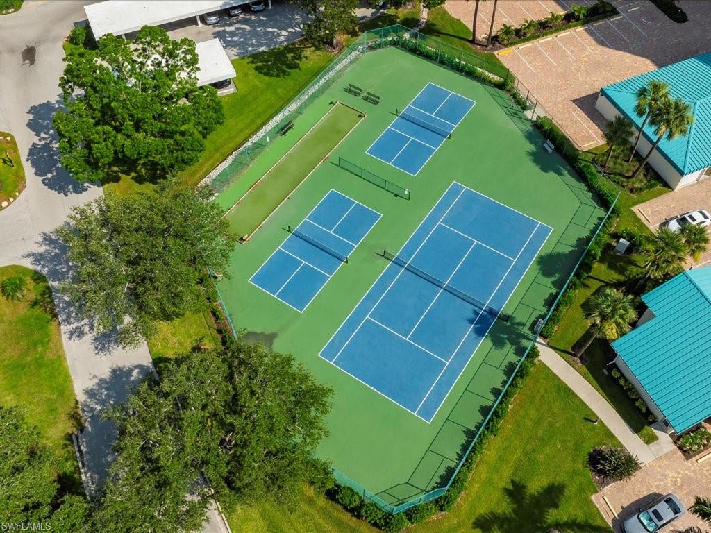 1 Bluebill Avenue, Unit 302 Naples, FL 34108 - Photo 13 of 21 an aerial view of a tennis ground