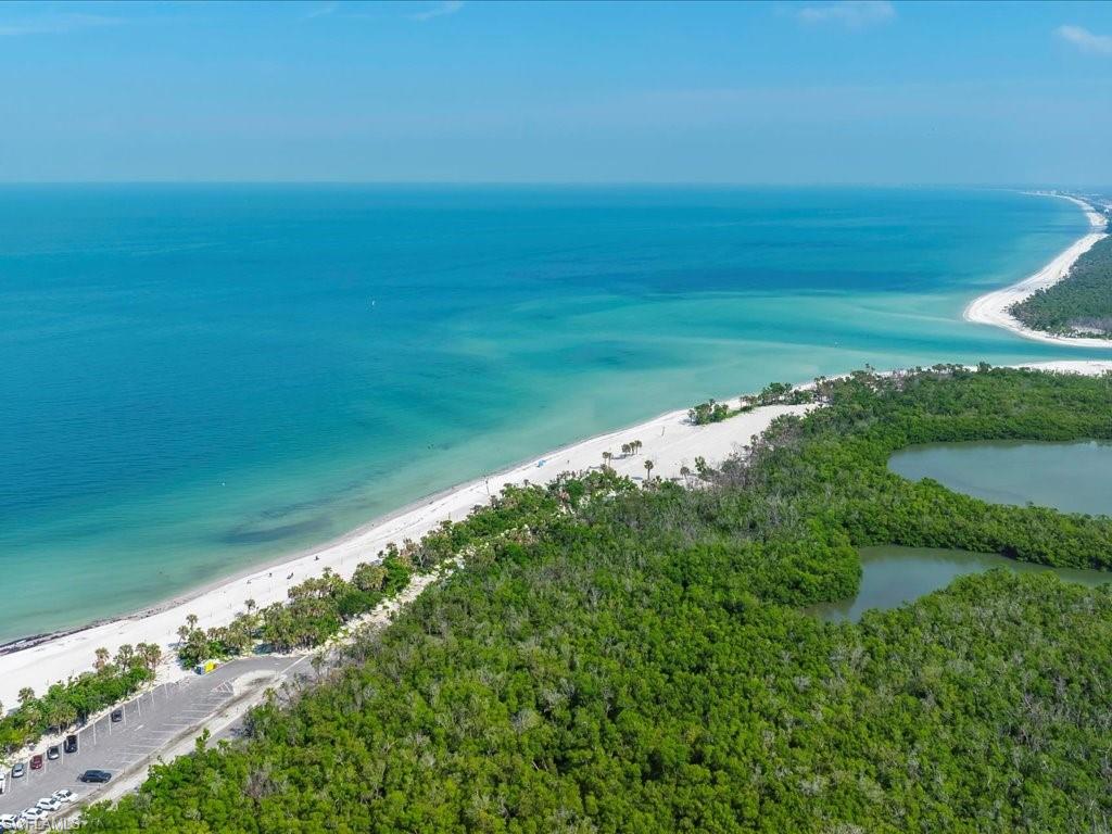 1 Bluebill Avenue, Unit 302 Naples, FL 34108 - Photo 19 of 21 a view of yard with ocean view