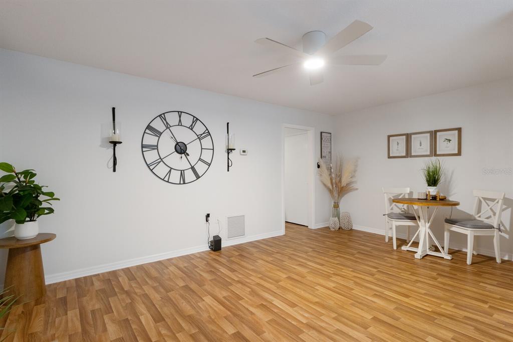 4444 Swift Road, Unit 4 Sarasota, FL 34231 - Photo 11 of 23 a bedroom with a bed and a chandelier