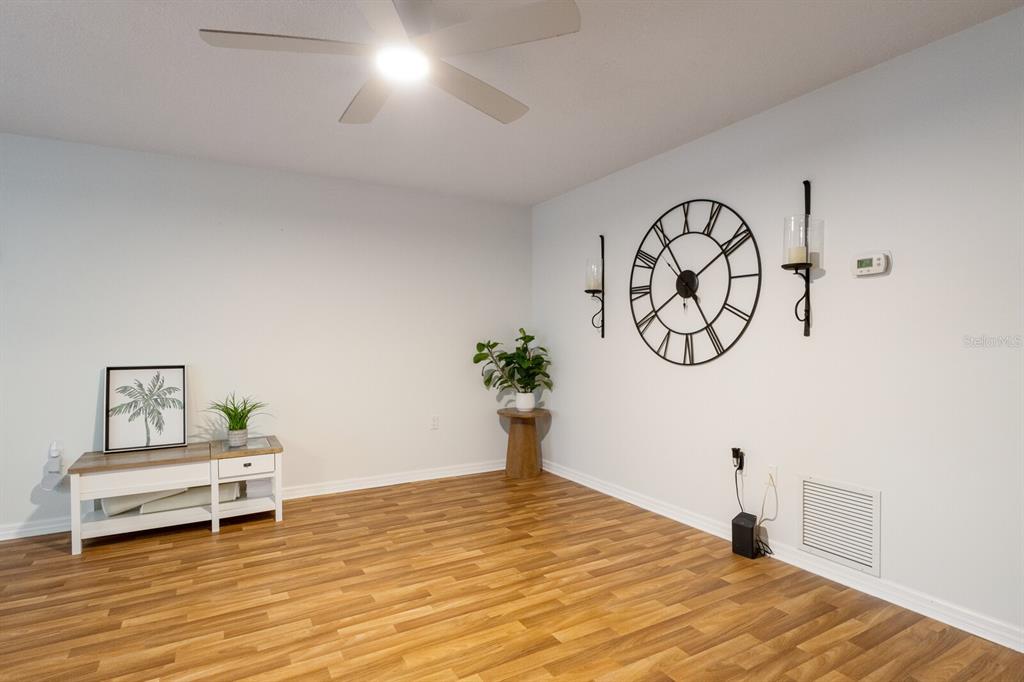 4444 Swift Road, Unit 4 Sarasota, FL 34231 - Photo 13 of 23 a bedroom with a bed and a chandelier