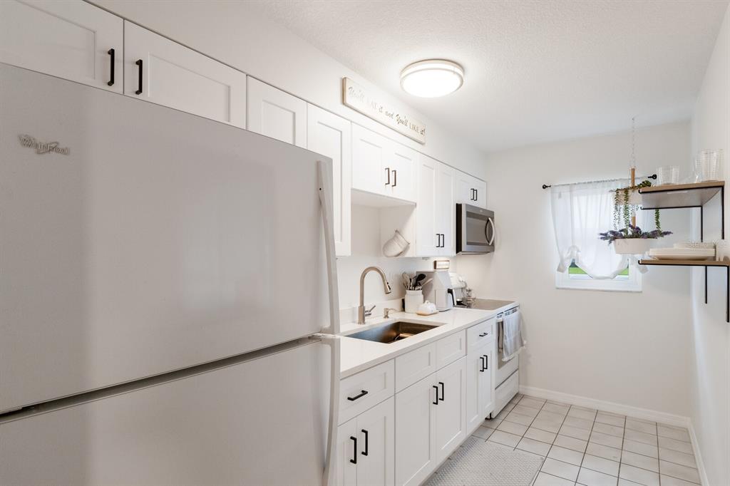 4444 Swift Road, Unit 4 Sarasota, FL 34231 - Photo 15 of 23 a kitchen with stainless steel appliances a sink and a refrigerator