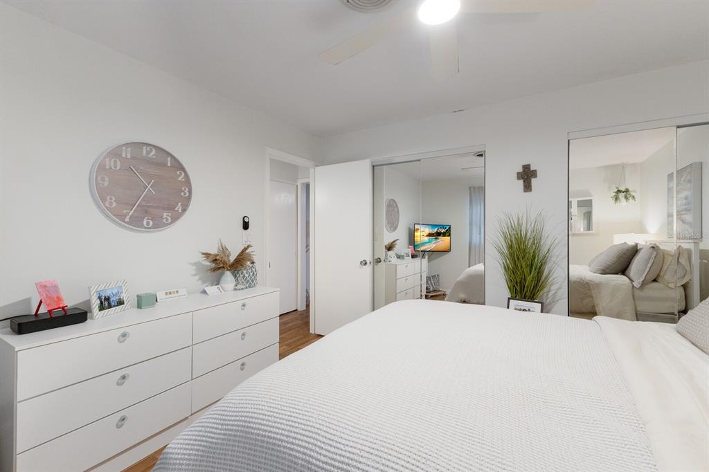 4444 Swift Road, Unit 4 Sarasota, FL 34231 - Photo 20 of 23 a bedroom with a bed and a chandelier