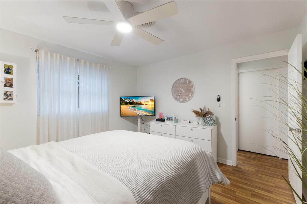 4444 Swift Road, Unit 4 Sarasota, FL 34231 - Photo 21 of 23 a bedroom with a bed and a flat screen tv