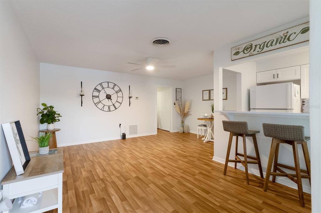 4444 Swift Road, Unit 4 Sarasota, FL 34231 - Photo 5 of 23 a living room with furniture and wooden floor