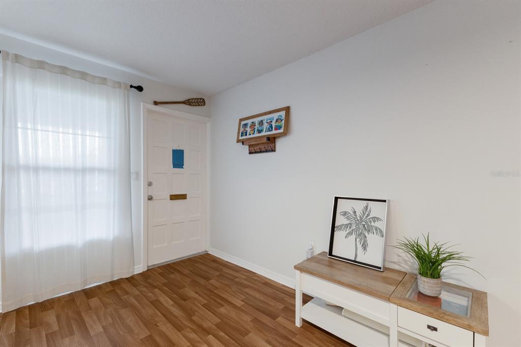 4444 Swift Road, Unit 4 Sarasota, FL 34231 - Photo 7 of 23 a view of room with window and wooden floor