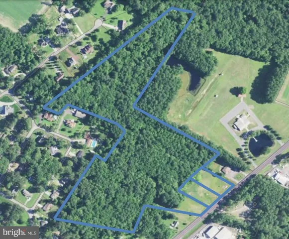 an aerial view of a residential houses with outdoor space