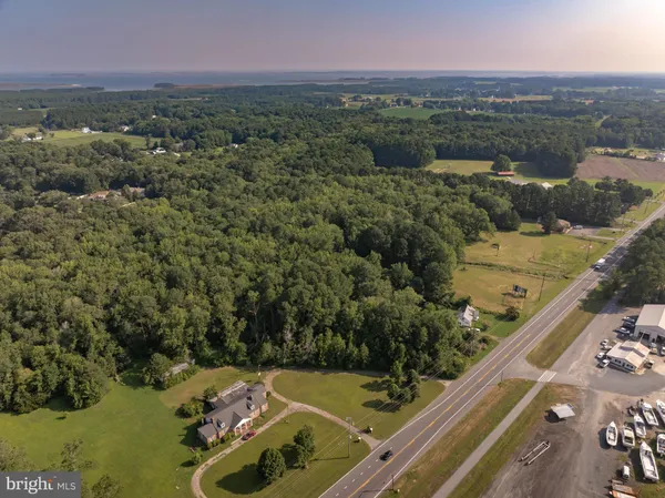 an aerial view of a residential houses with outdoor space