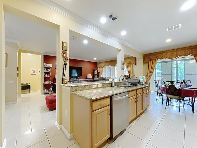 a living room with furniture a rug and a large window