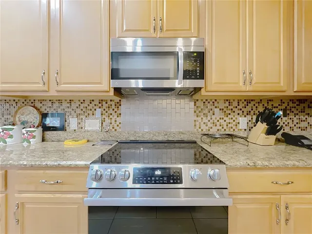 a view of a workspace with furniture and wooden floor