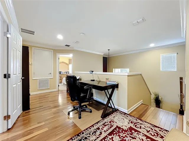 a bedroom with a bed and a mirror