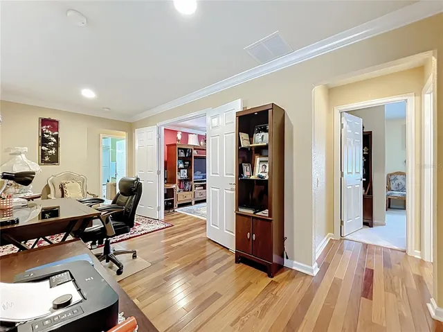 a bedroom with a bed and a flat tv screen