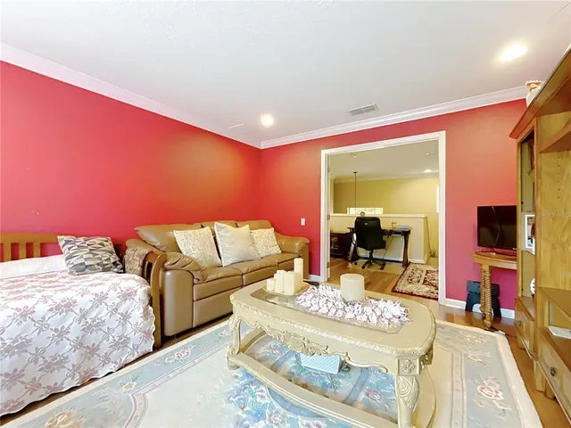 a bed room with a bed and a chandelier