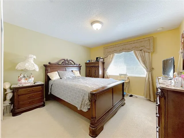 a large bathroom with a double vanity sink a mirror and a shower