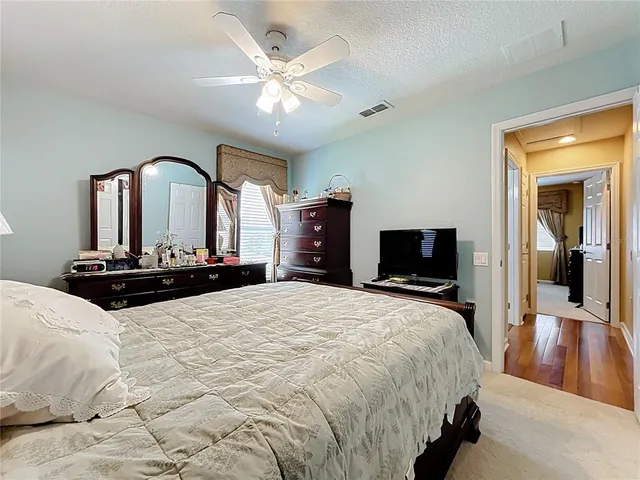 a bathroom with a toilet a sink and a window