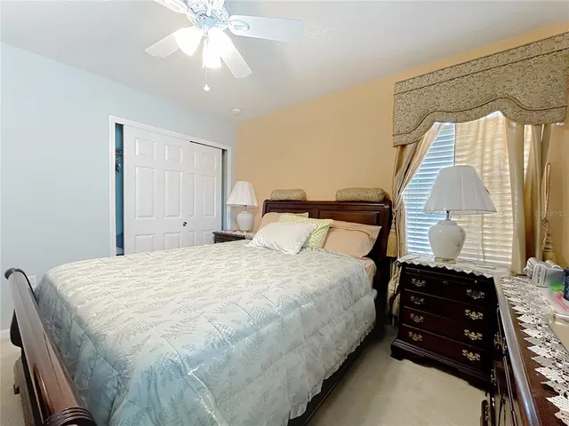 a view of a patio with table and chairs potted plants