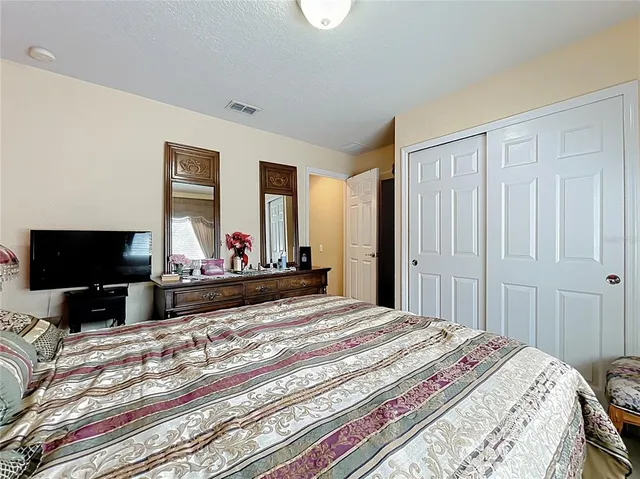 an aerial view of a city with lots of residential buildings and ocean view