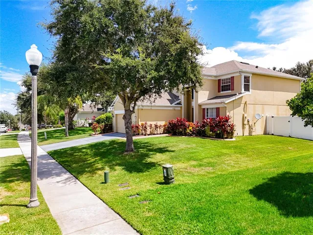a view of a dining room with furniture and a window