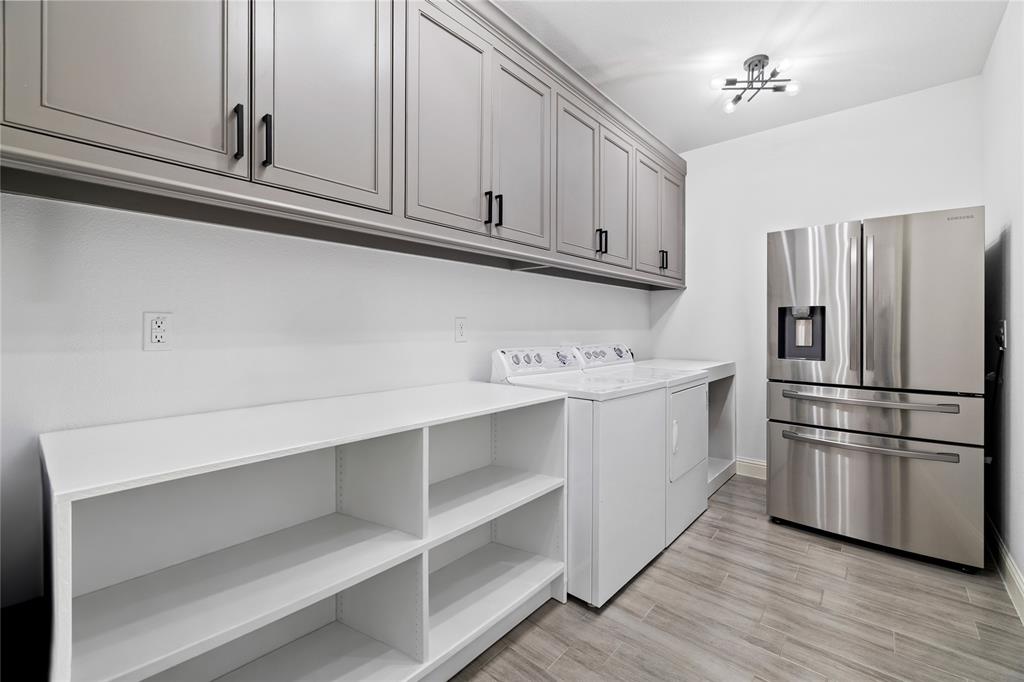 203 Colonial Drive Mabank, TX 75156 - Photo 21 of 36 a kitchen with cabinets and stainless steel appliances