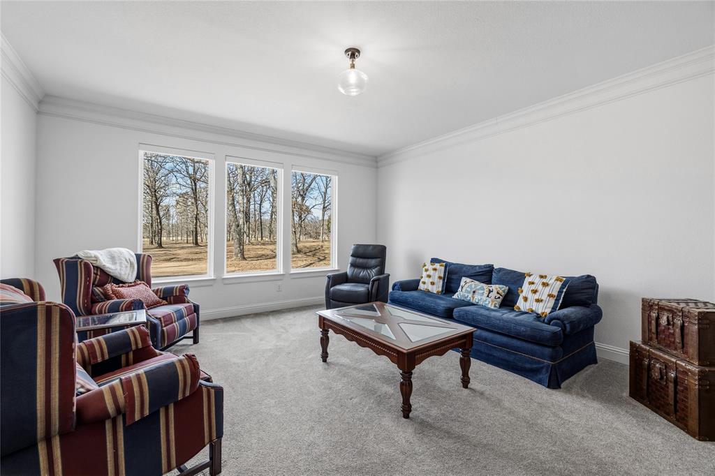 203 Colonial Drive Mabank, TX 75156 - Photo 22 of 36 a living room with furniture and a large window