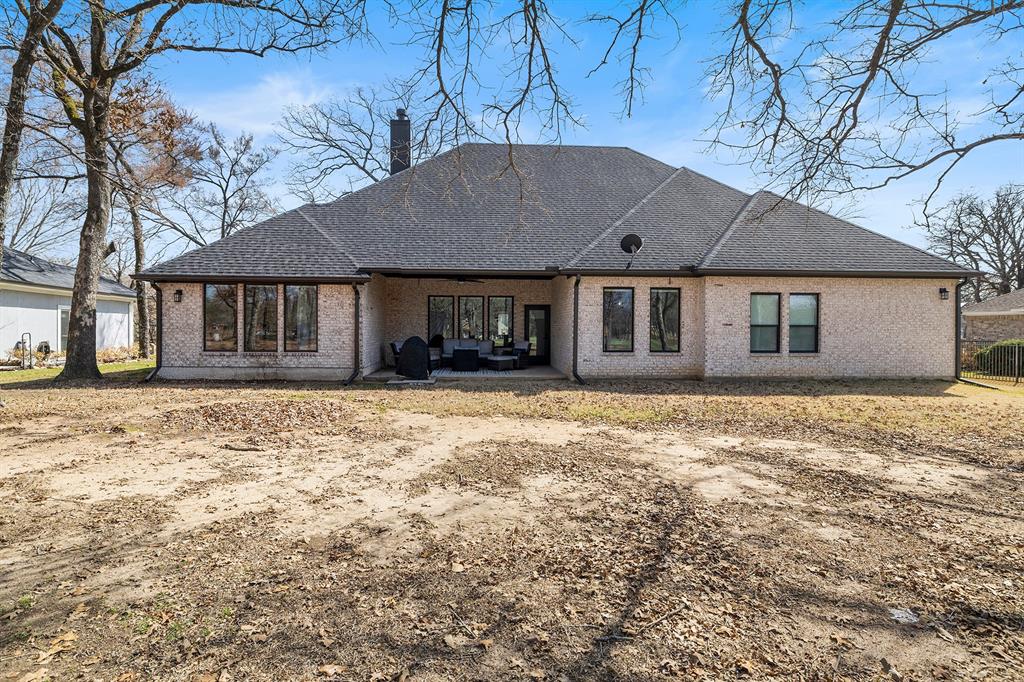 203 Colonial Drive Mabank, TX 75156 - Photo 33 of 36 front view of a house with a yard
