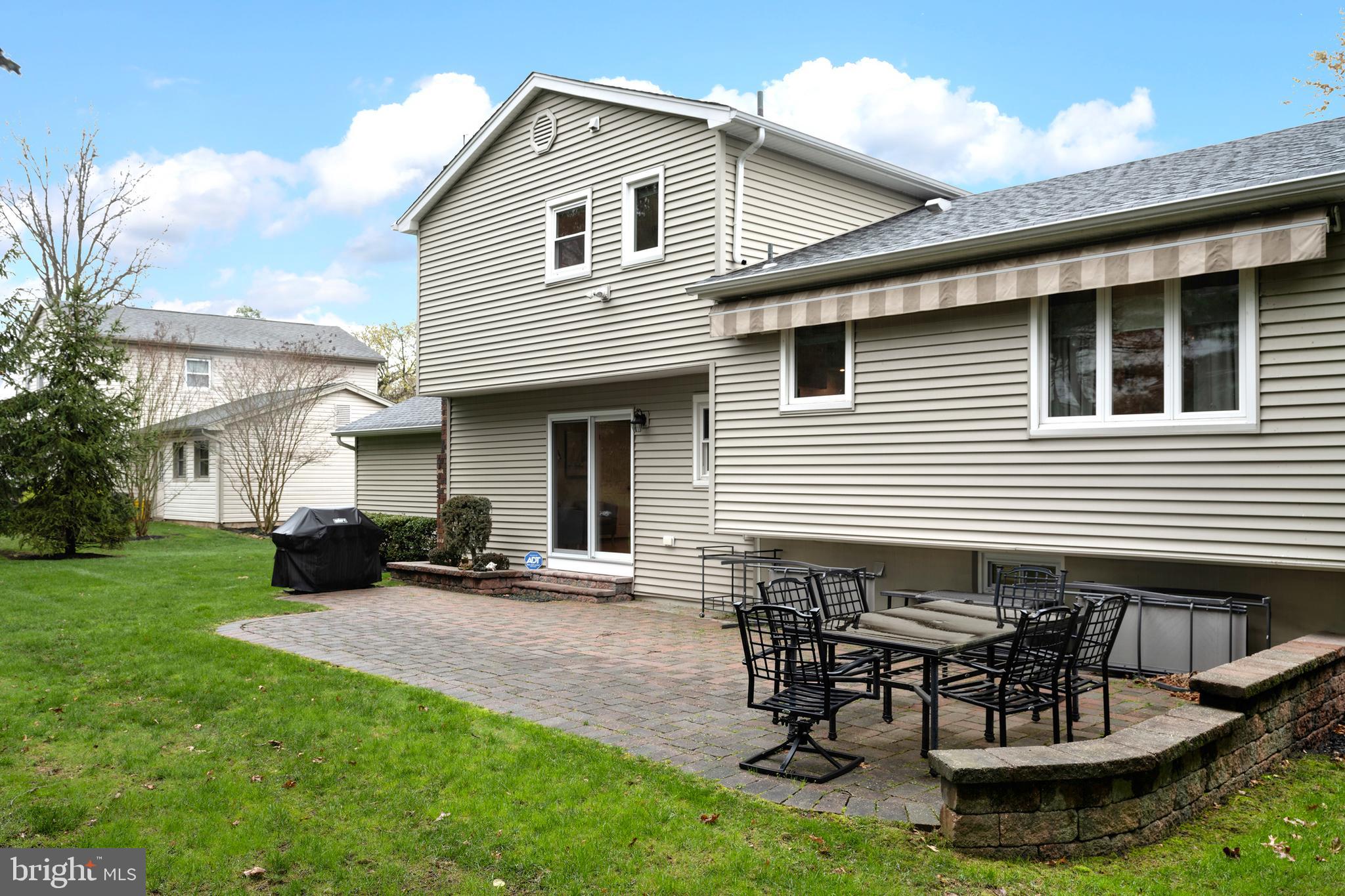 59 Wesleyan Drive Hamilton, NJ 08690 - Photo 23 of 25 a view of a house with backyard and sitting area