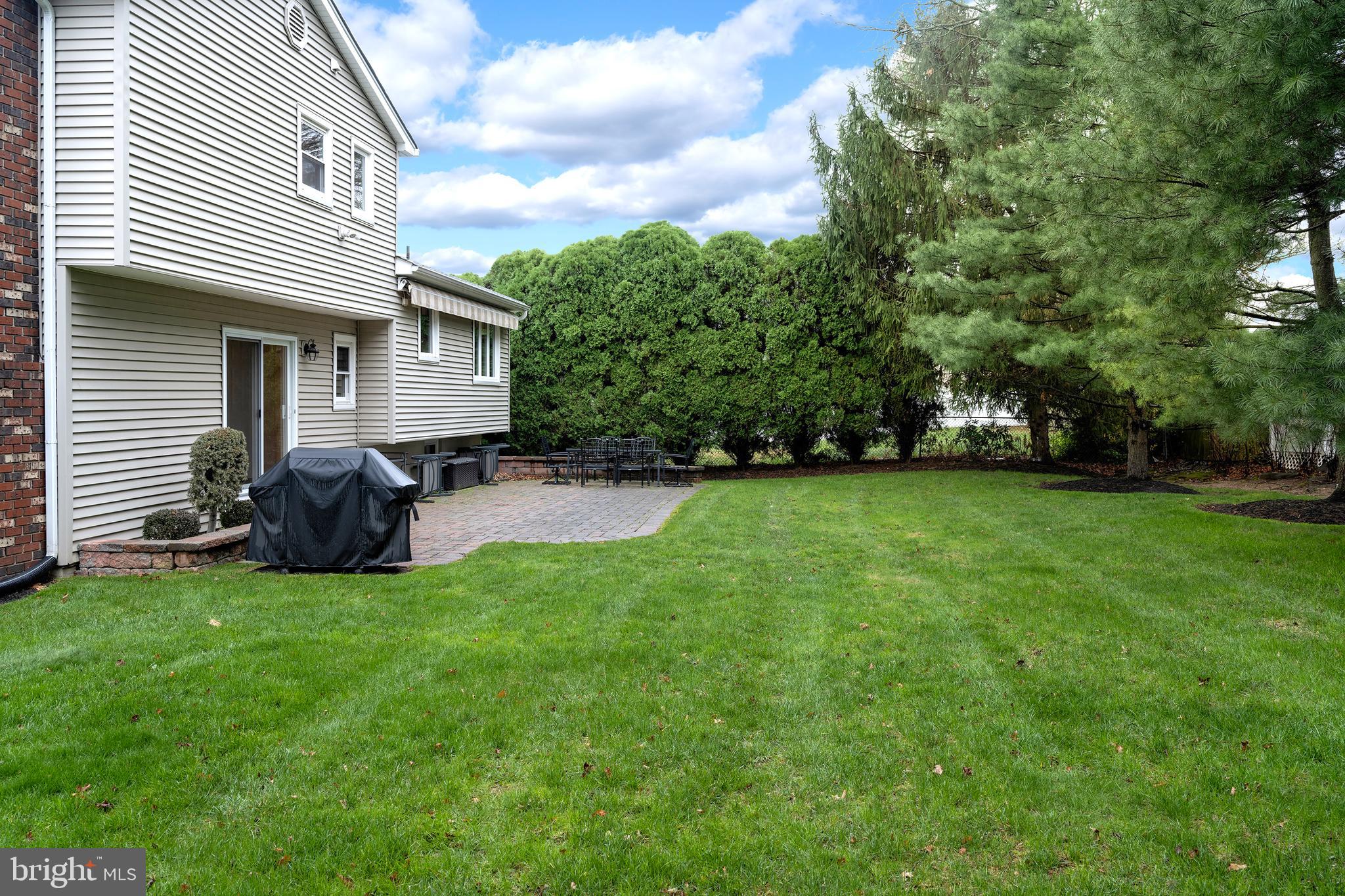 59 Wesleyan Drive Hamilton, NJ 08690 - Photo 24 of 25 a view of a backyard of the house