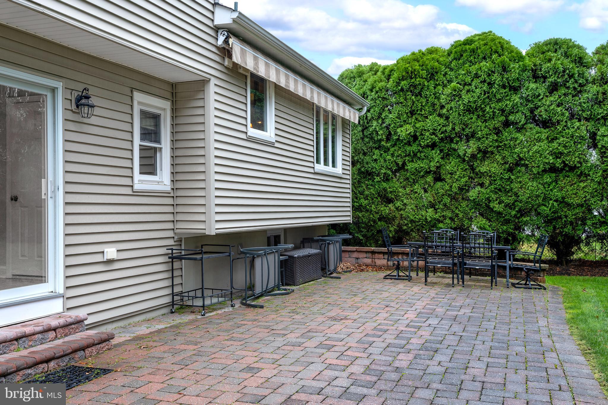 59 Wesleyan Drive Hamilton, NJ 08690 - Photo 25 of 25 a view of a chairs and table in the back yard of the house