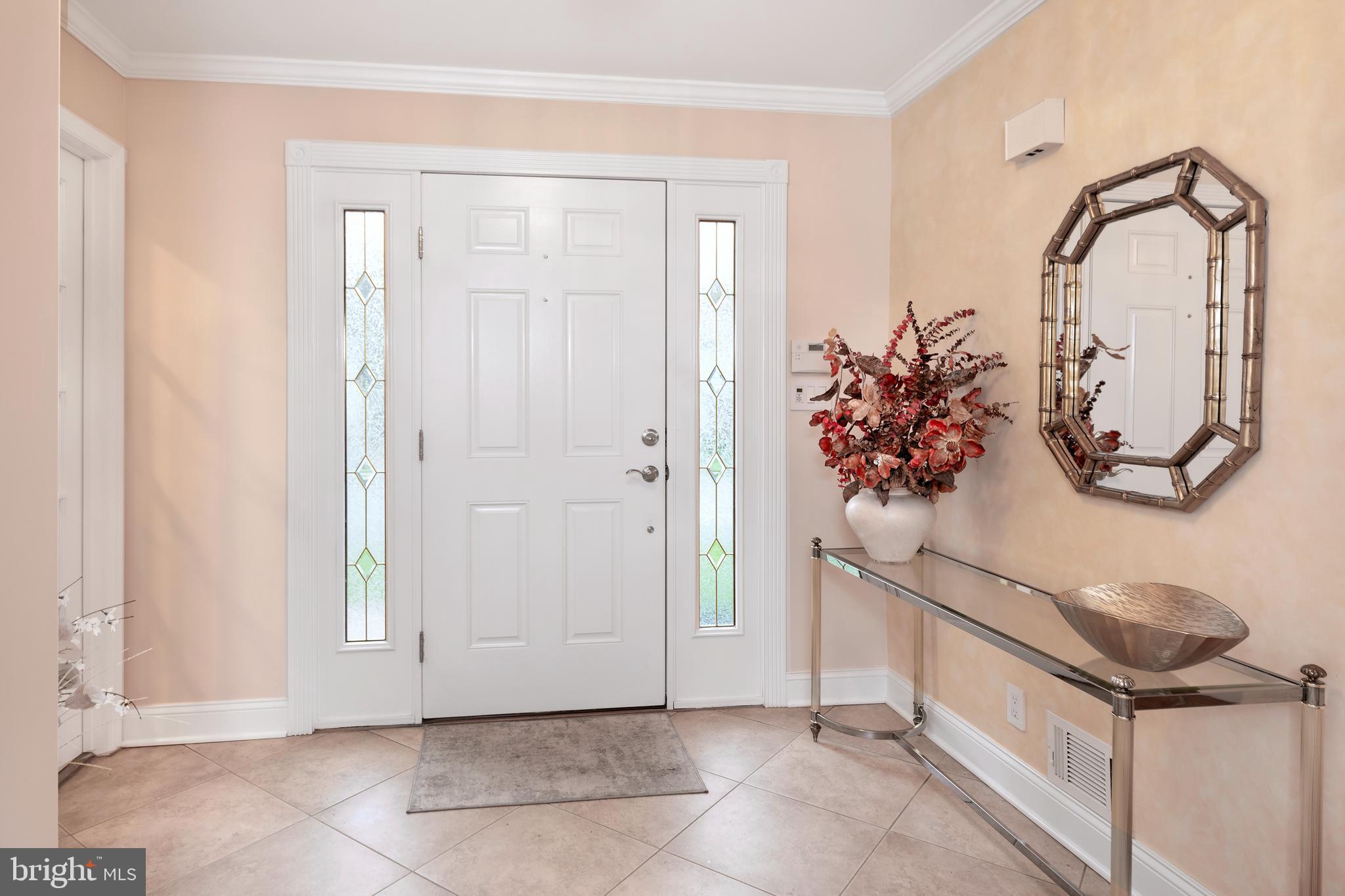 59 Wesleyan Drive Hamilton, NJ 08690 - Photo 4 of 25 a view of a bathroom with a sink and mirror
