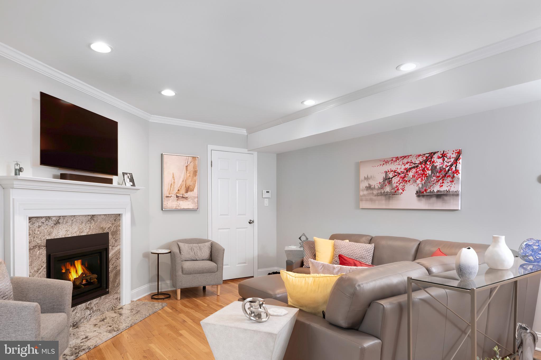 59 Wesleyan Drive Hamilton, NJ 08690 - Photo 6 of 25 a living room with furniture and a fireplace
