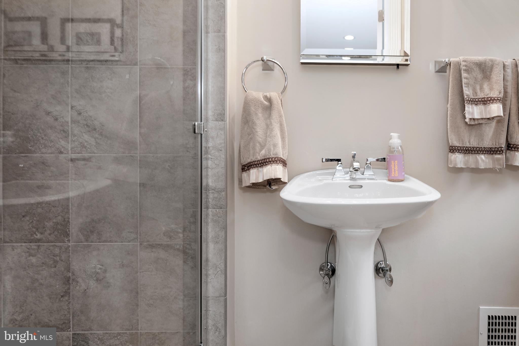 59 Wesleyan Drive Hamilton, NJ 08690 - Photo 8 of 25 a bathroom with a sink