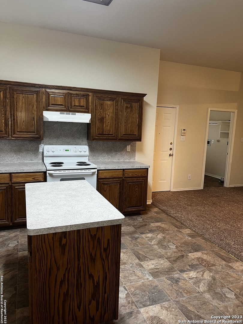 12610 Point Sound San Antonio, TX 78253 - Photo 13 of 39 a kitchen that has a sink and a stove in it