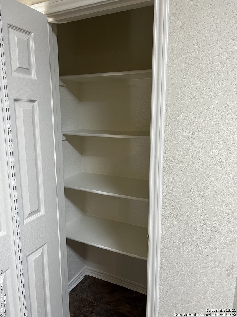 12610 Point Sound San Antonio, TX 78253 - Photo 14 of 39 a view of walk in closet with empty racks