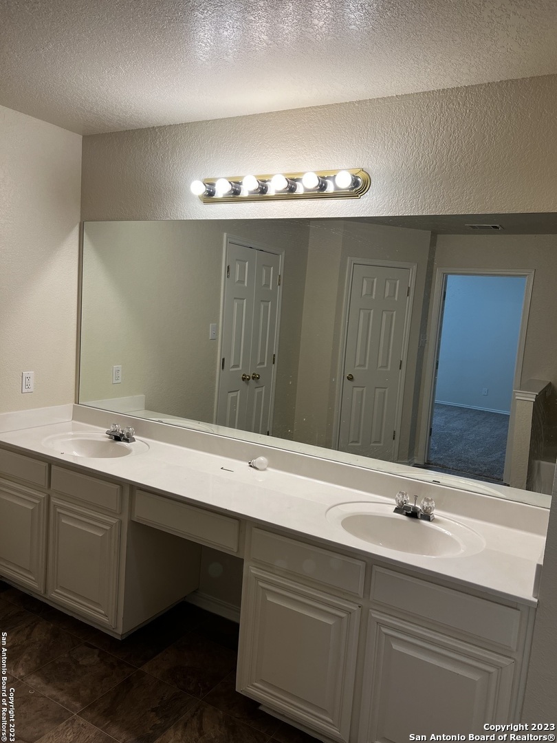 12610 Point Sound San Antonio, TX 78253 - Photo 29 of 39 a bathroom with a sink and a mirror
