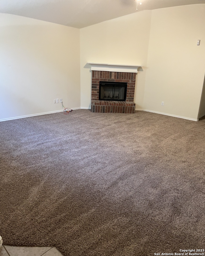 12610 Point Sound San Antonio, TX 78253 - Photo 7 of 39 an empty room with a fireplace