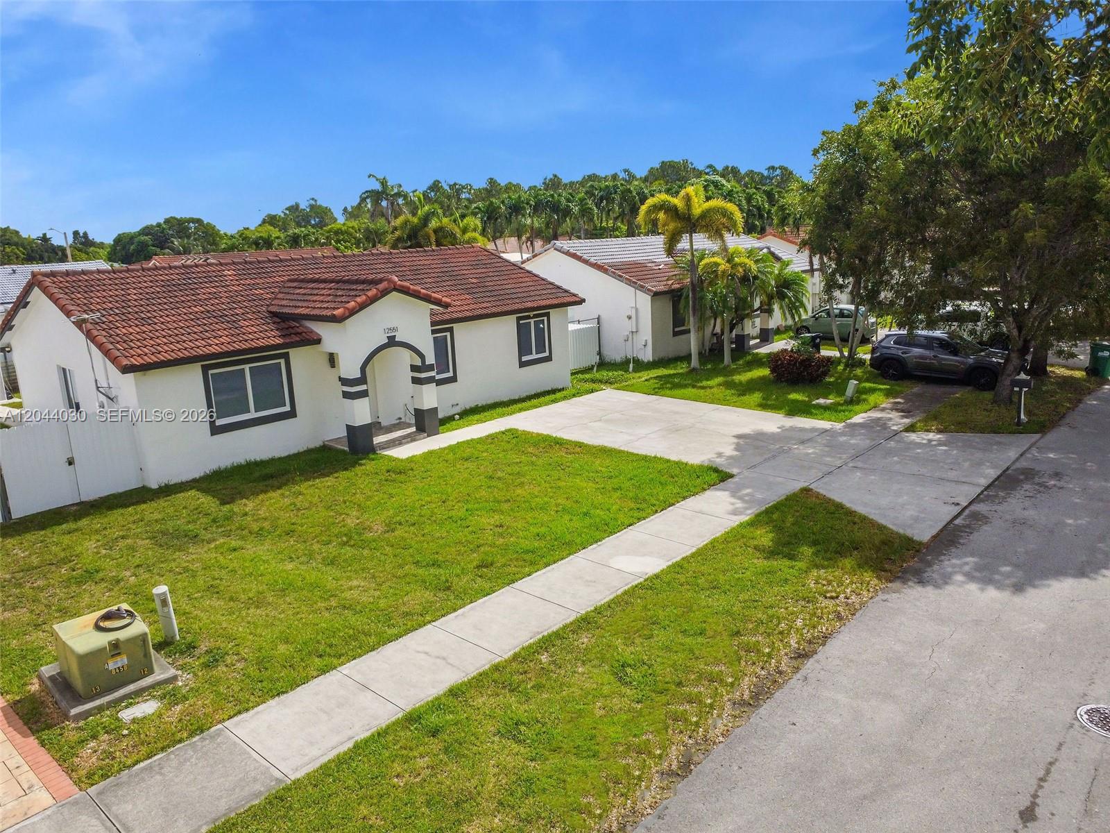 12551 Southwest 223rd Street Miami, FL 33170 - Photo 29 of 35 a aerial view of a house with garden
