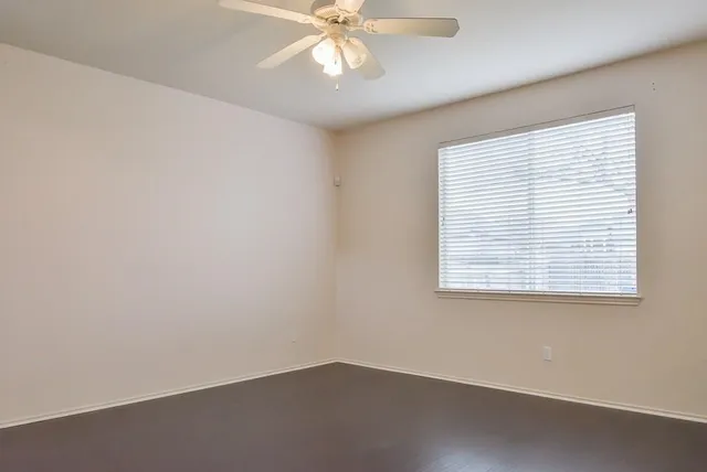 a view of staircase with white walls and wooden floor
