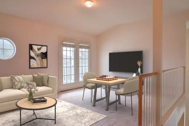 a living room with furniture and a chandelier