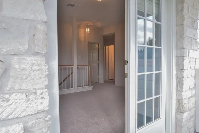 a view of a balcony with wooden floor