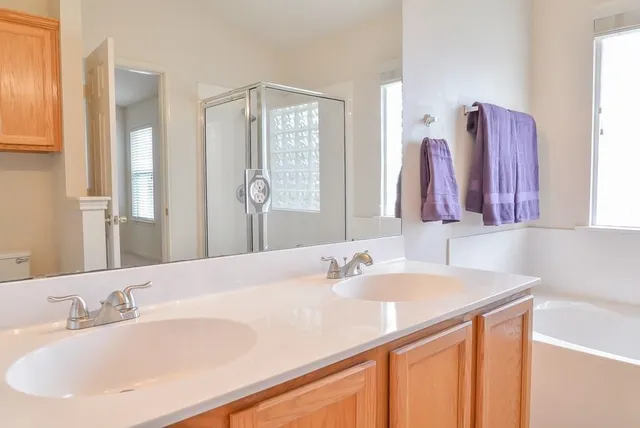 a bathroom with a bathtub and a sink