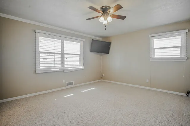 a view of an empty room with a window