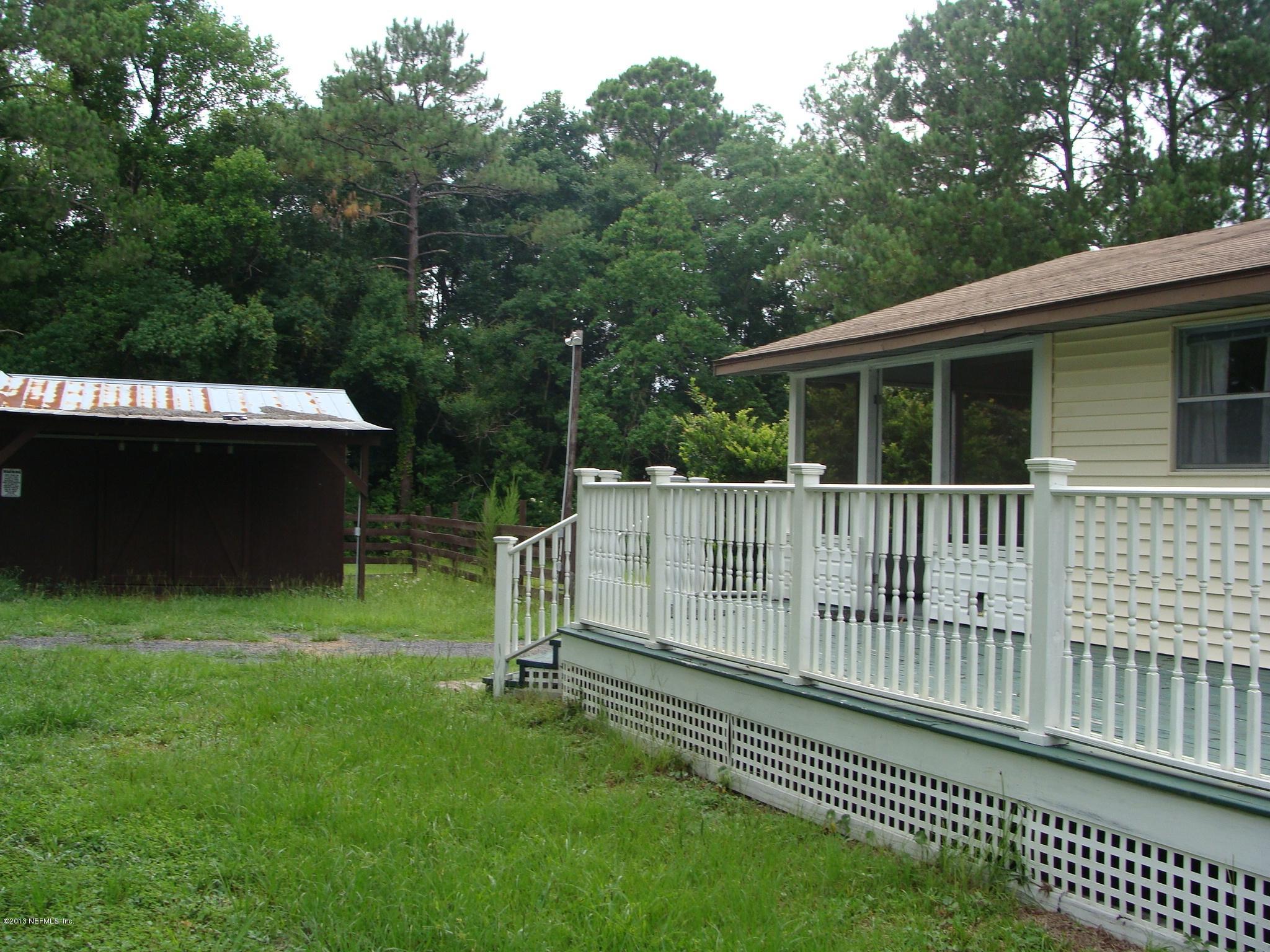 4149 Bronco Road Middleburg, FL 32068 - Photo 9 of 14 a house view with a garden space