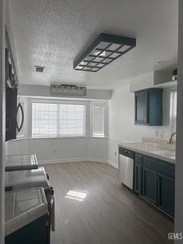 a view of a room with two sinks and a window