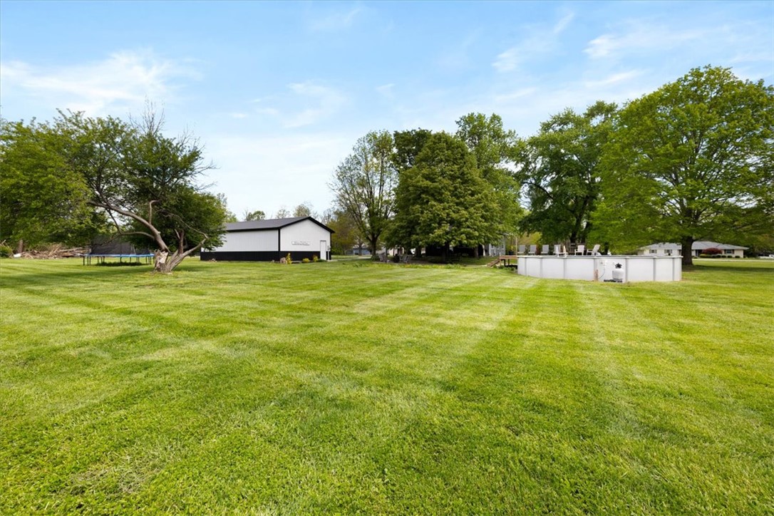 5120 Wheelock Road Troy, OH 45373 - Photo 48 of 67 Expansive outdoor area featuring a spacious yard, inviting pool, and versatile outbuilding.