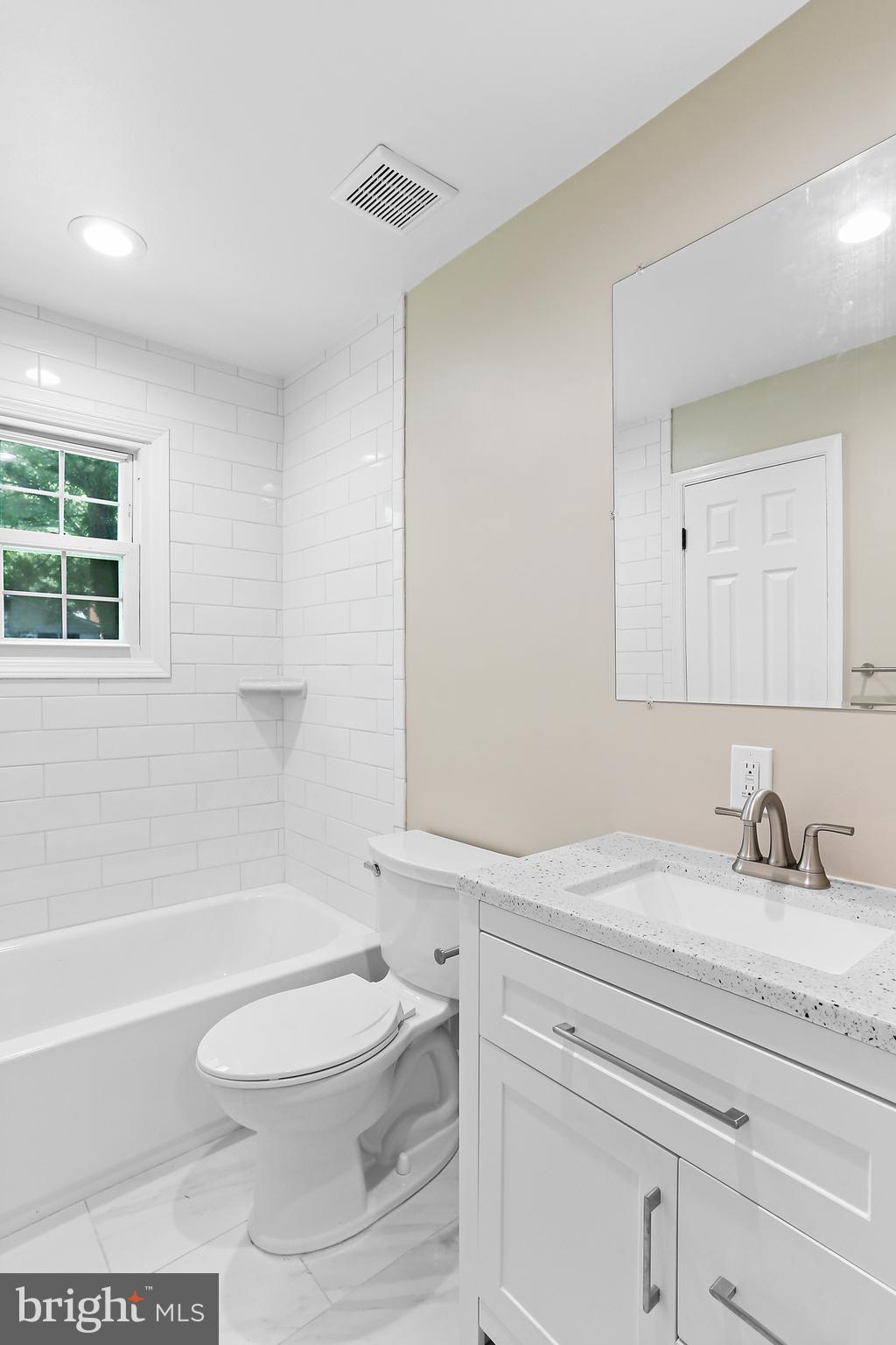 4113 Weller Road Silver Spring, MD 20906 - Photo 13 of 35 a bathroom with a sink a toilet and a bathtub